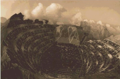 Illustration of a crowded outdoor amphitheater, with multiple lightning strikes on the main stage.