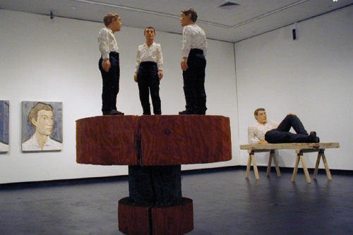 installation view at Bell Gallery with Three Men on a Sculpted Pedestal in foreground